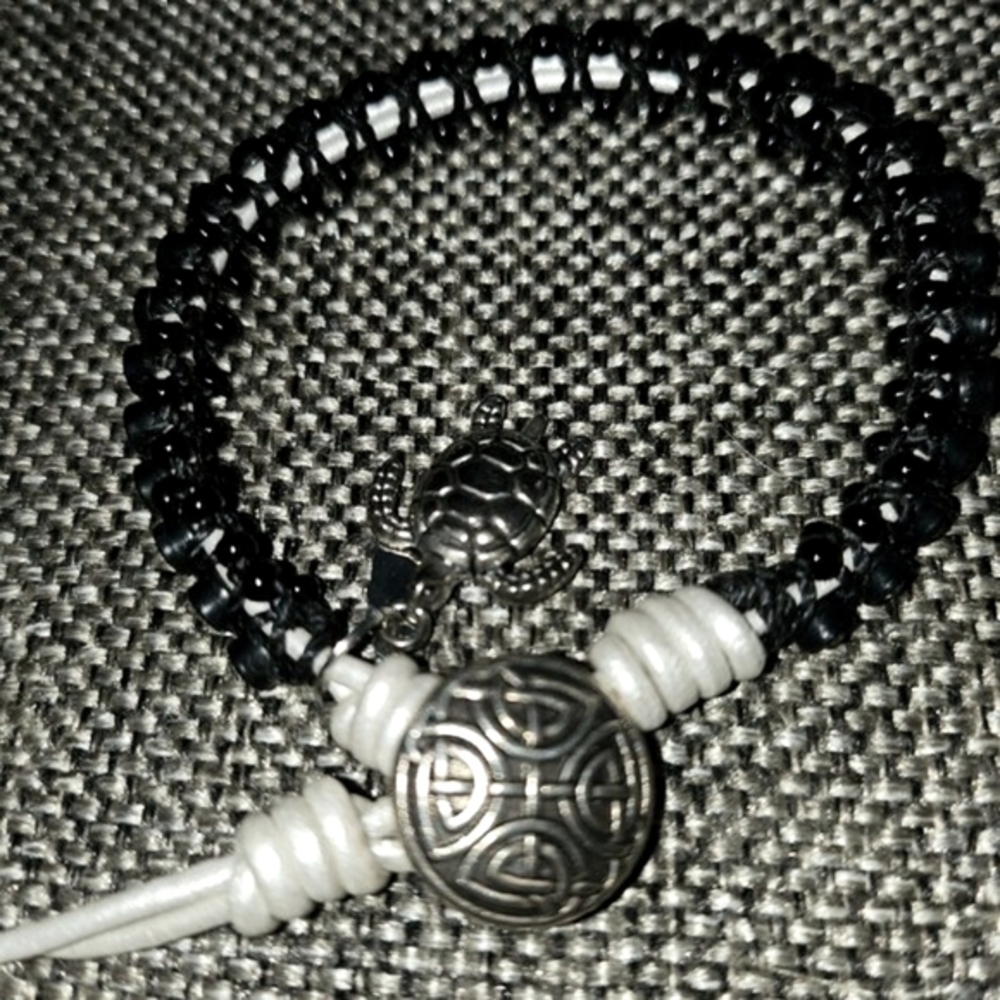 Bracelet with Rhinestones Set in Black Beads with White Tie and Turtle Charm